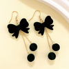 Velvety Bow Dangle Earrings: Black